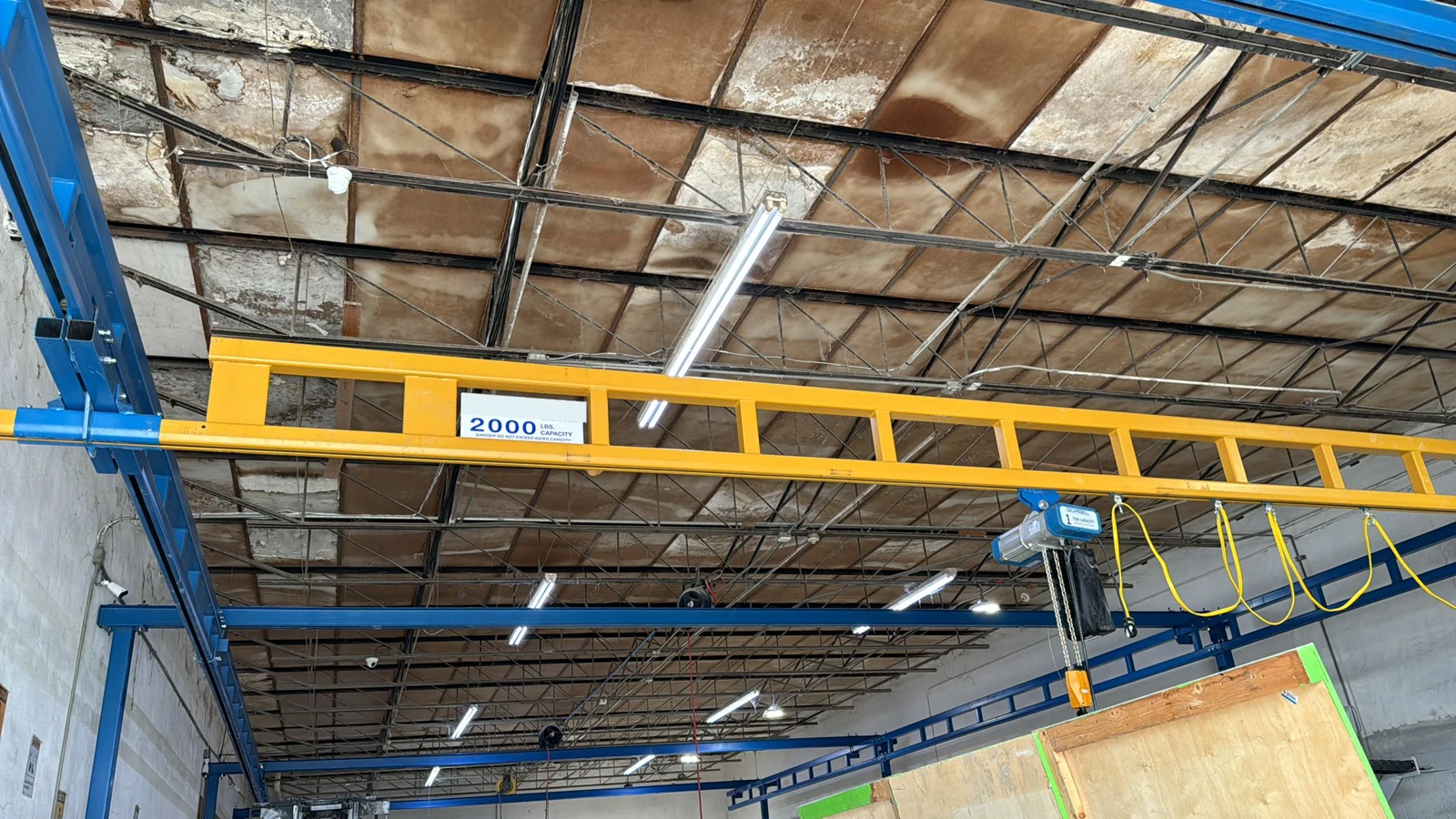 Workstation crane from a Next Level installation. Final dimensions and equipment follow your approved configuration.